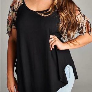 Plus size black top with floral sleeves